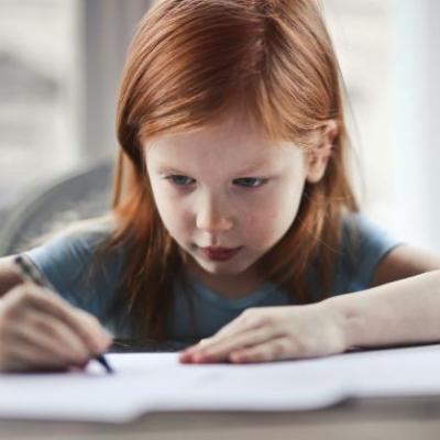 Image of child writing